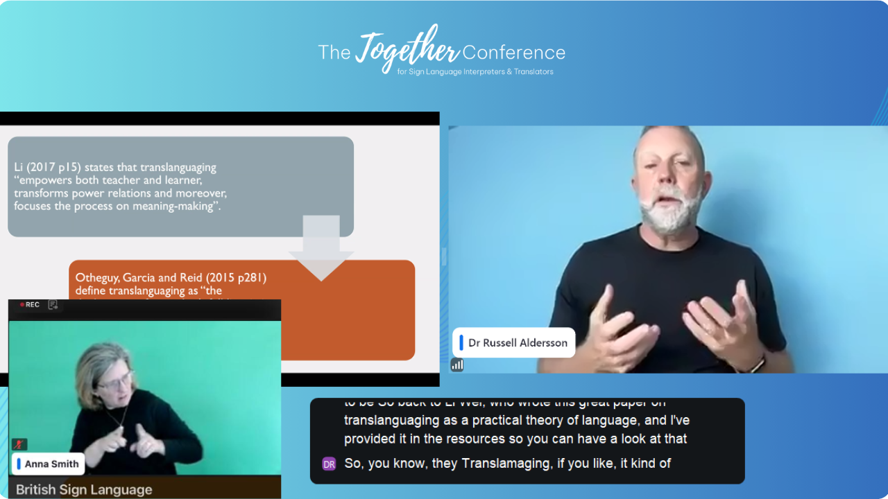 A presenter and BSL interpreter during the 2026 conference